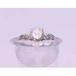 An 18 ct white gold five stone diamond ring. Centre stone spreading to approximately 0.5 carat.