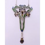 An Art Nouveau style silver pendant on chain. The pendant 7.5 cm high.