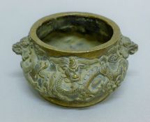 A Chinese bronze censer decorated with dragons. 13.5 cm wide.