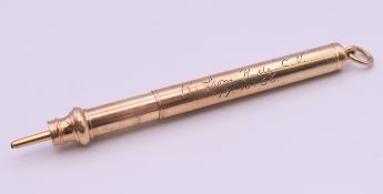 A E Baker & Son 9 ct gold propelling pencil, inscribed. 6.5 cm long. 16.5 grammes total weight.