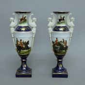 A pair of porcelain vases decorated with hunt scenes. 33 cm high.