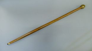 A four faced bronze Buddha handled walking stick. 92 cm long.