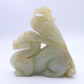 A jade dog-of-fo and phoenix. 7 cm wide.