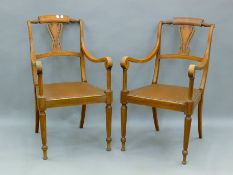 A pair of walnut open armchairs. 54.5 cm wide.