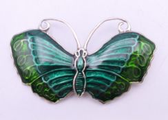 A silver butterfly brooch. 5 cm wide.