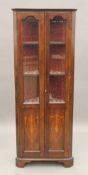 An Edwardian inlaid mahogany corner cabinet. 150 cm high.