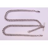 A silver watch chain. 67 cm long. 98.4 grammes.