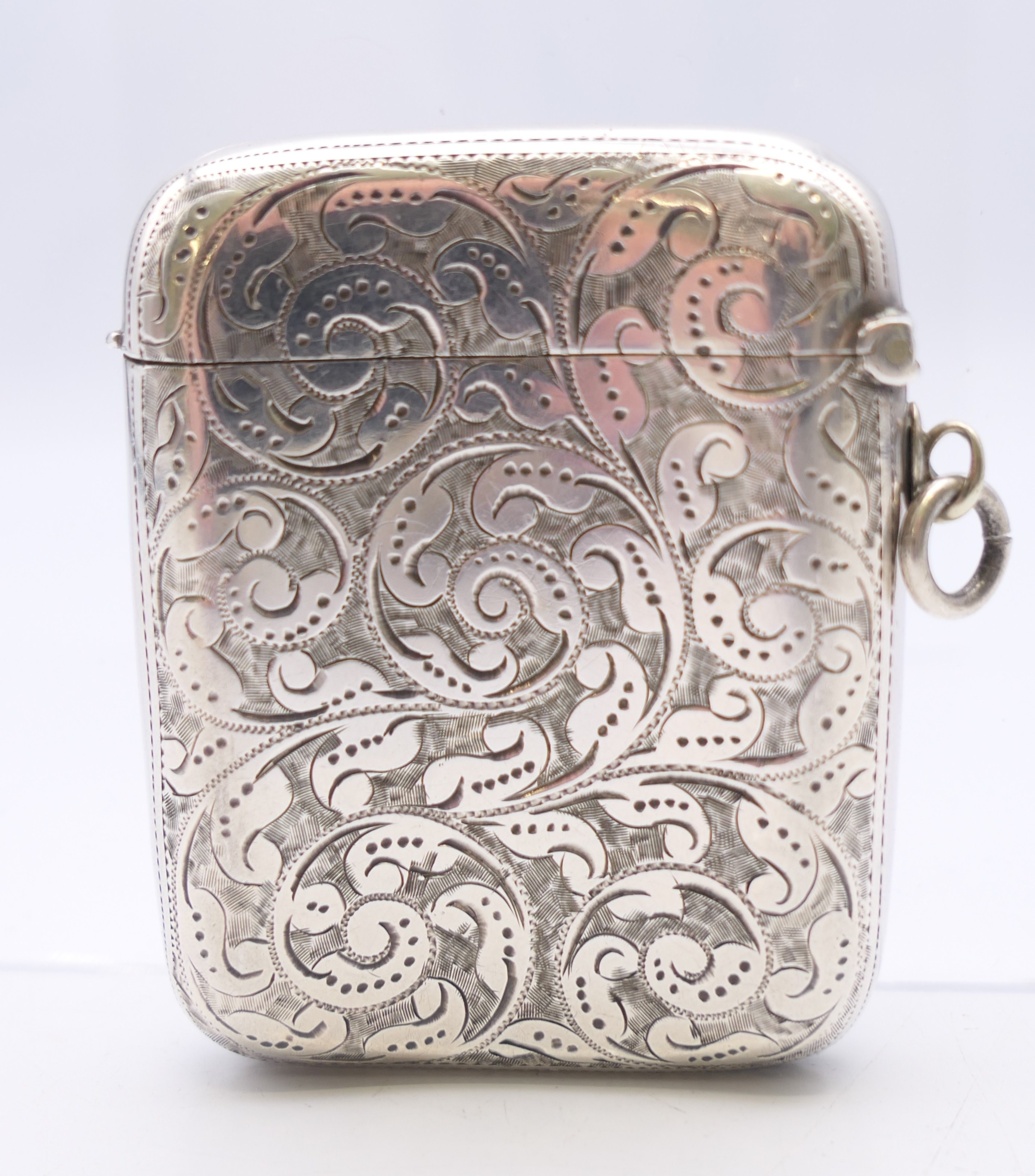 A Victorian silver vesta with leaf chased pattern, Birmingham 1894. 4.5 cm wide, 5.5 cm high. - Image 2 of 4