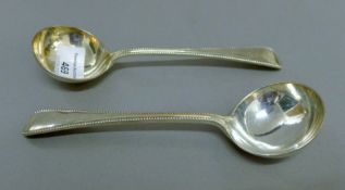 A pair of silver sauce ladles. 17.5 cm long. 156.2 grammes.
