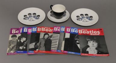A small quantity of Beatles magazines, a Beatles cup and saucer, and two plates.