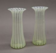 A pair of late Victorian vaseline glass vases. 19.5 cm high.