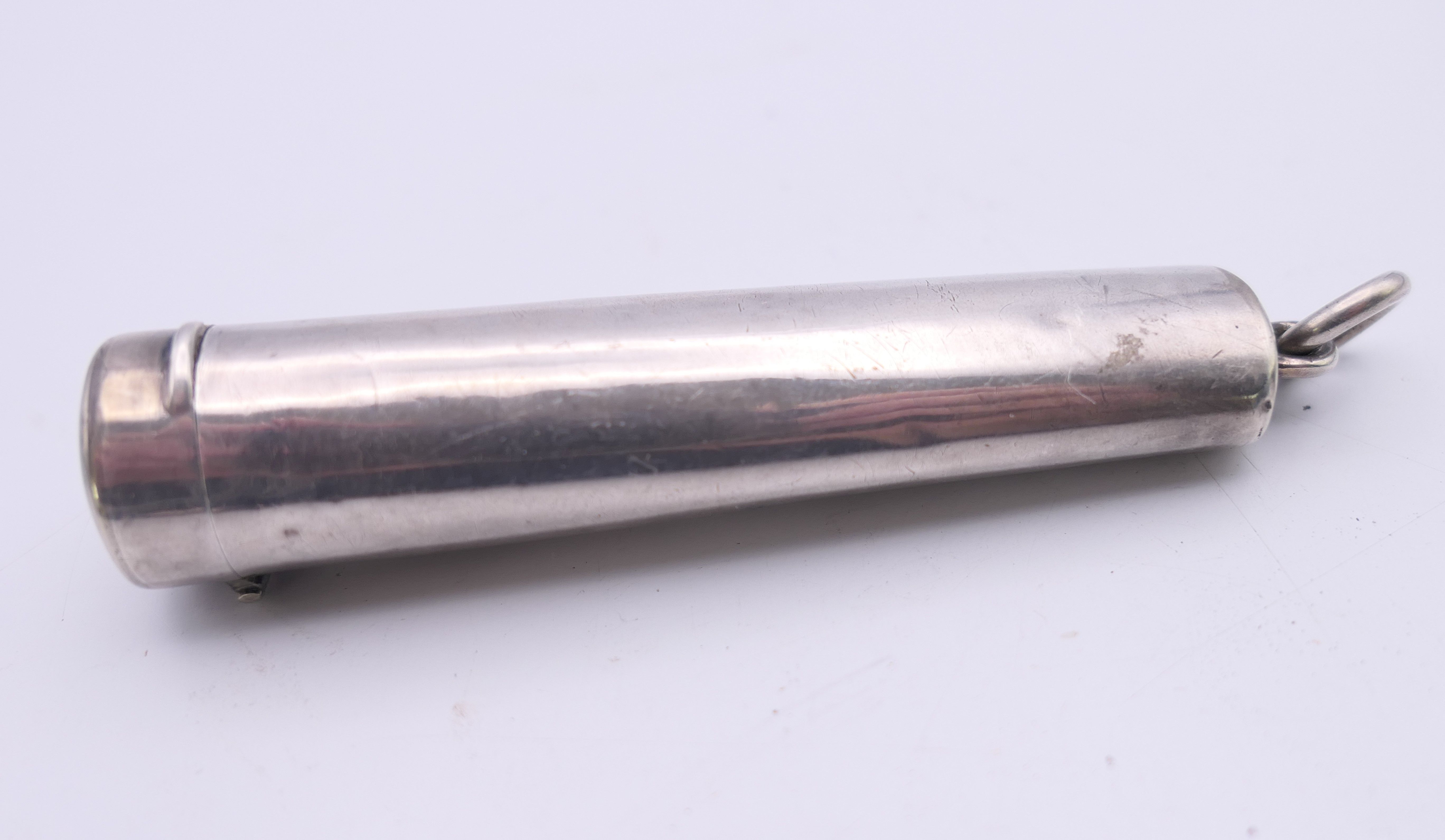 A silver case enclosing a cheroot holder, hallmarked for Birmingham. 7 cm long. 12. - Image 2 of 6