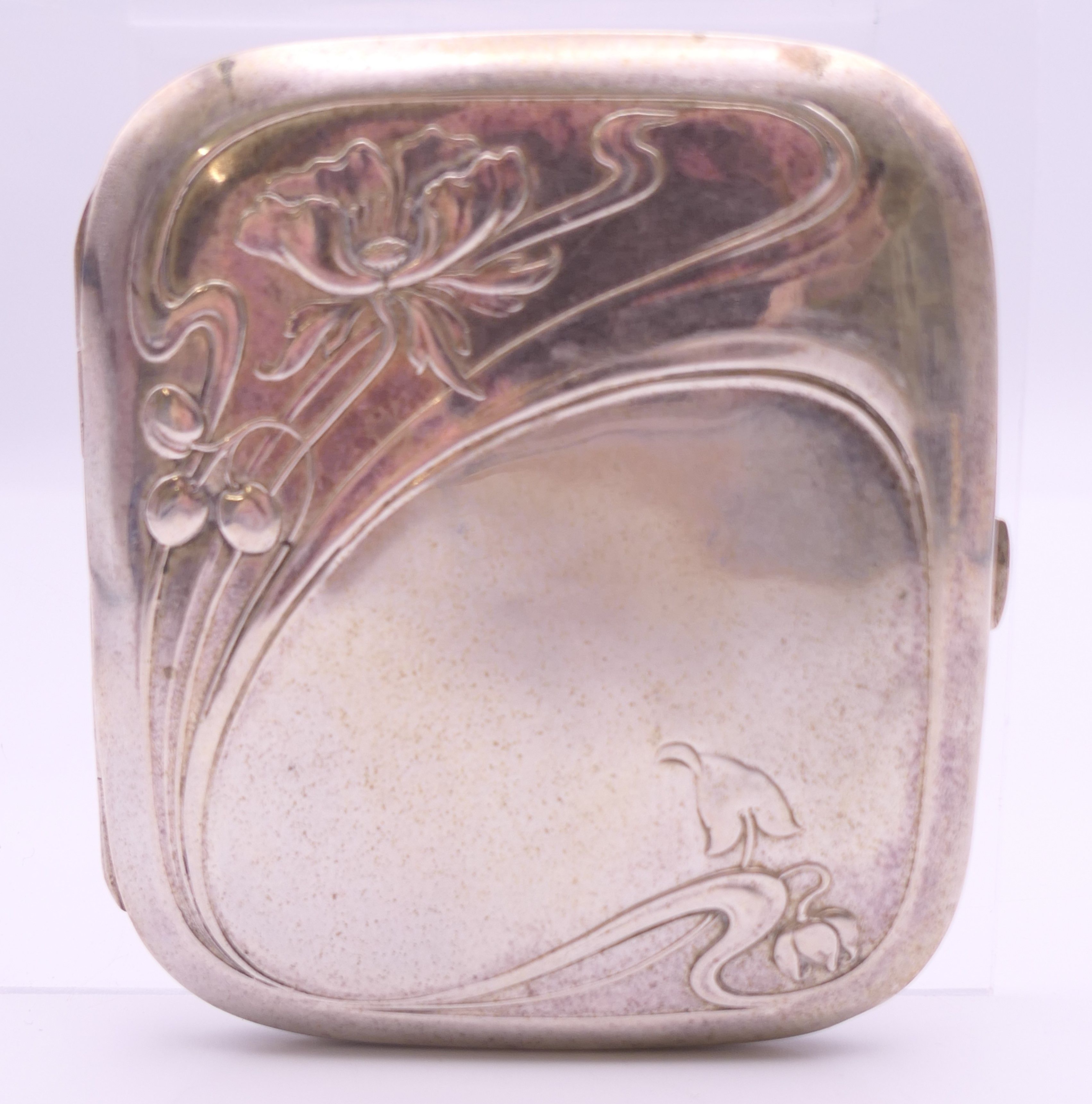 An Art Nouveau 800 silver cigarette case. 8 cm wide. 78.6 grammes total weight. - Image 2 of 8