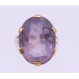 A 9 ct gold amethyst set ring. Ring size L/M. 7.6 grammes total weight.