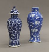 Two 19th century Chinese blue and white porcelain vases. The largest 22 cm high.