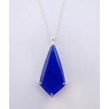 A silver necklace with lapis pendant. The pendant 3.5 cm high.