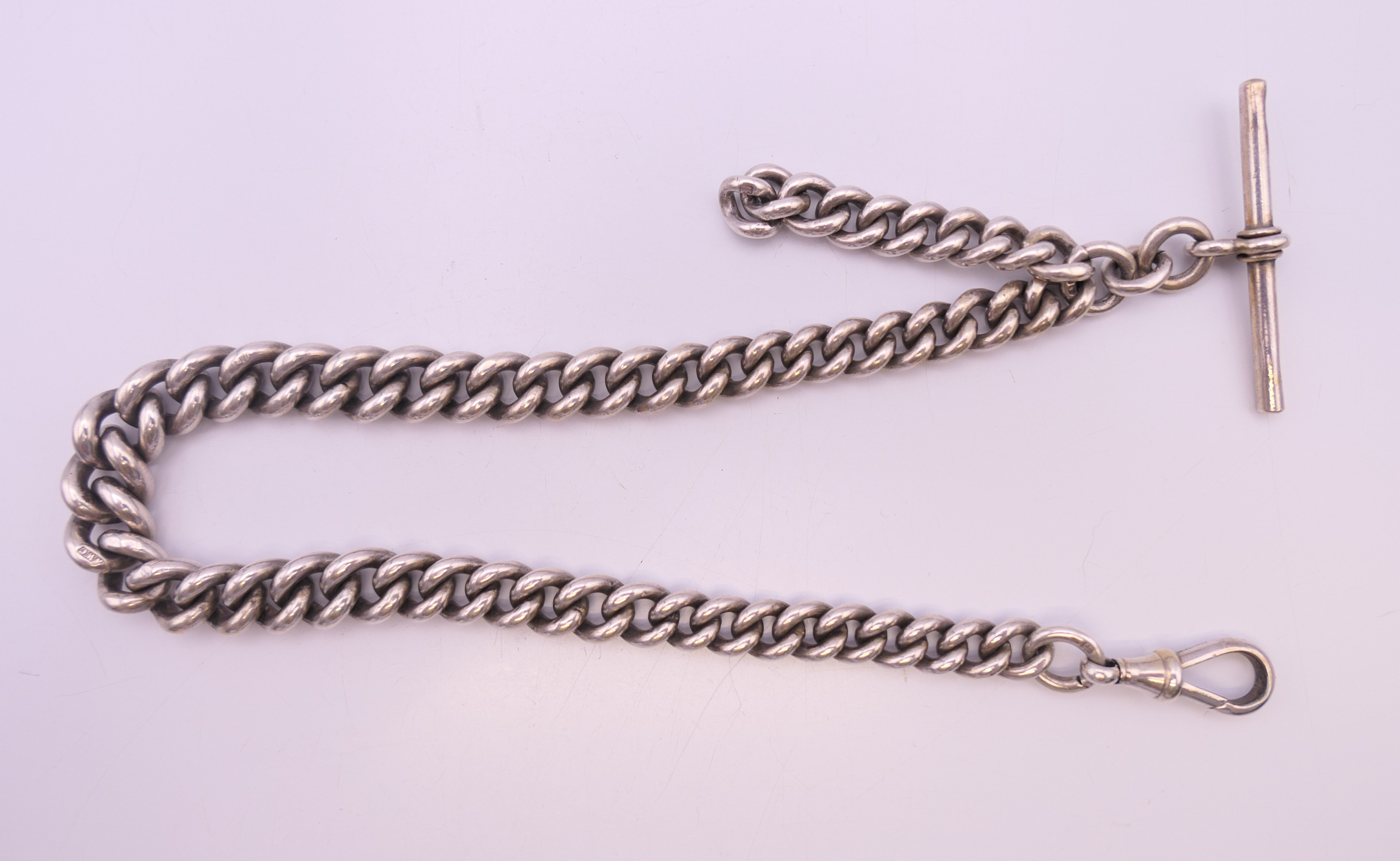 A silver watch chain. 34.5 cm long. 77.4 grammes.