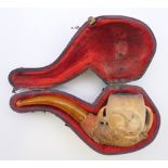 A Victorian cased Meerschaum pipe formed as a claw, 10 cm long.