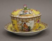 A 19th century Continental porcelain lidded sucriere and a dish. The latter 21 cm diameter.
