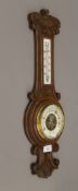 A Victorian oak wall barometer. 57 cm high.