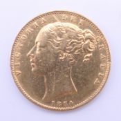 A Victorian gold sovereign, dated 1854.