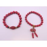 Two cinnabar bracelets.