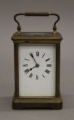 A brass carriage clock. 14 cm high.