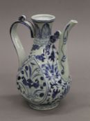 A Chinese blue and white porcelain ewer. 19 cm high.