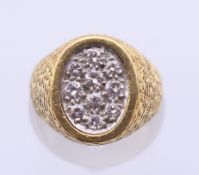 A Kutchinsky 18 K gold diamond ring. Ring size G. 13.3 grams total weight.