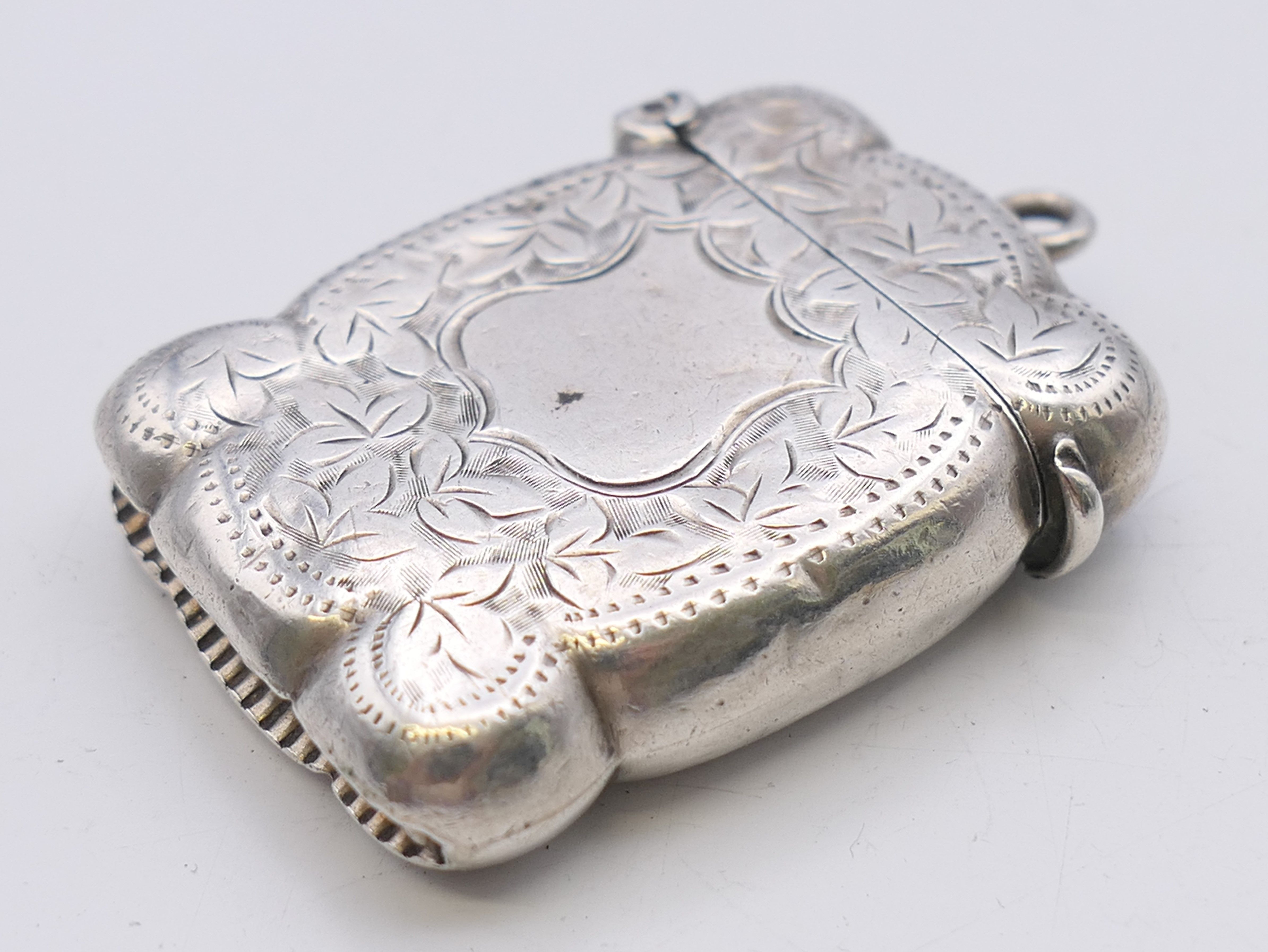 A Victorian silver vesta converted to a lighter, with leaf chased pattern, Birmingham 1875. - Image 3 of 6