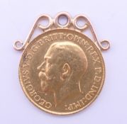A George V gold sovereign, dated 1913, with pendant mount. 8.6 grammes total weight.