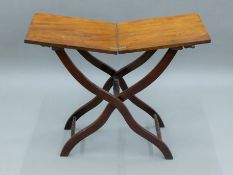 A 19th century mahogany coaching table. 35 cm wide.