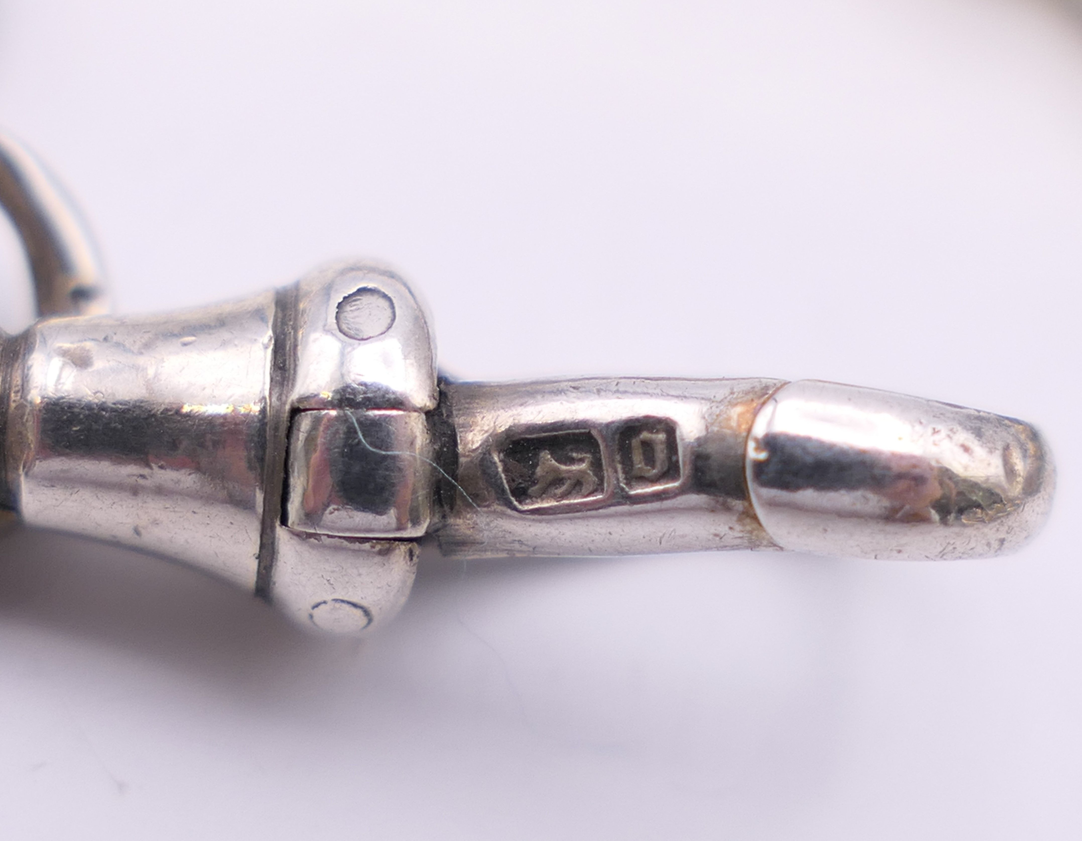 A silver watch chain. 67 cm long. 98.4 grammes. - Image 7 of 7