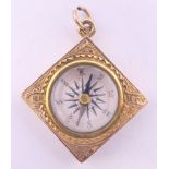 A 10 ct gold square compass fob. 2.5 cm high. 4.6 grammes total weight.