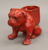 A pottery vase formed as a bull dog. 15.5 cm high.