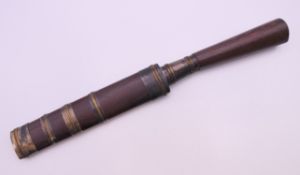 An Asian white metal and wooden dagger. 24.5 cm long.