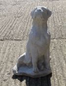 A garden ornament formed as a boxer dog. 51 cm high.