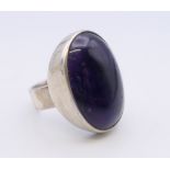 A silver and amethyst ring. Ring size L/M. 11.4 grammes total weight.