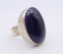A silver and amethyst ring. Ring size L/M. 11.4 grammes total weight.