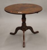 A George III yew wood tripod table (reduced in height). 62 cm diameter.