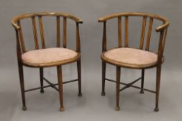 A pair of Edwardian open tub armchairs. 53 cm wide.