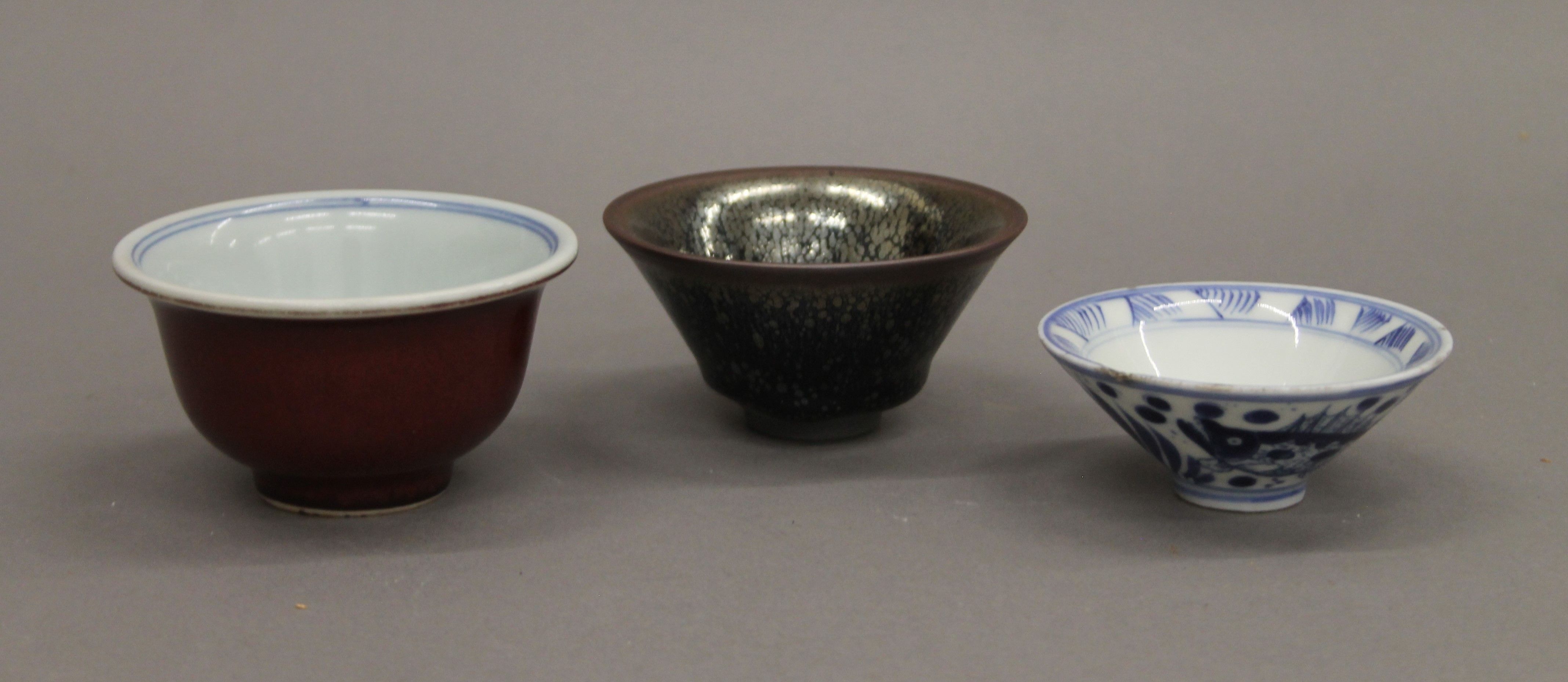 Three Chinese porcelain tea bowls. The largest 9.5 cm diameter.