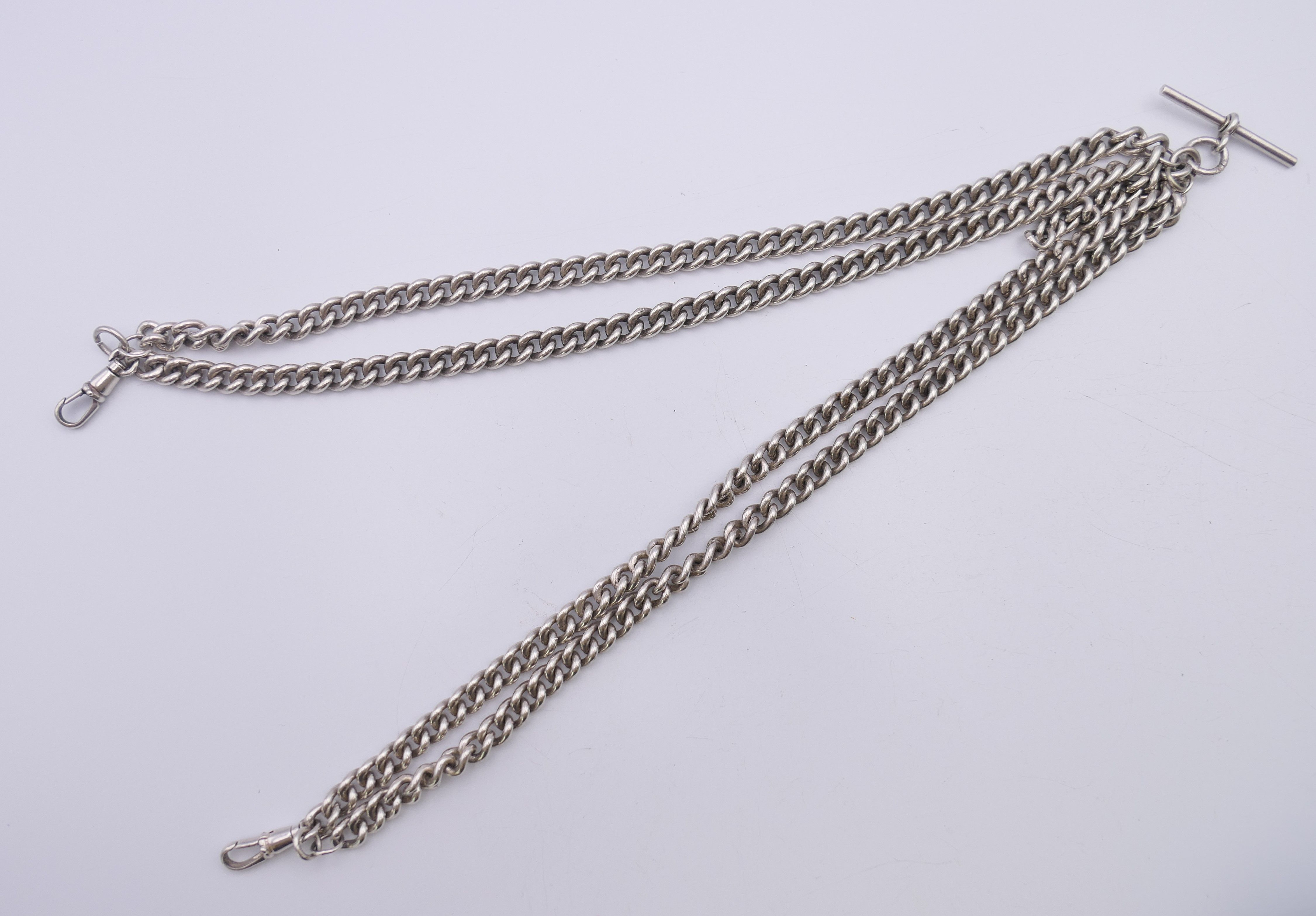 A silver curb link double Albert watch chain. 54.5 cm long. 145.5 grammes. - Image 2 of 5