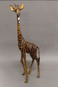 A wooden model of a giraffe. 92.5 cm high.