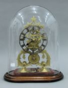 A brass skeleton clock under glass clock. 36 cm high overall.