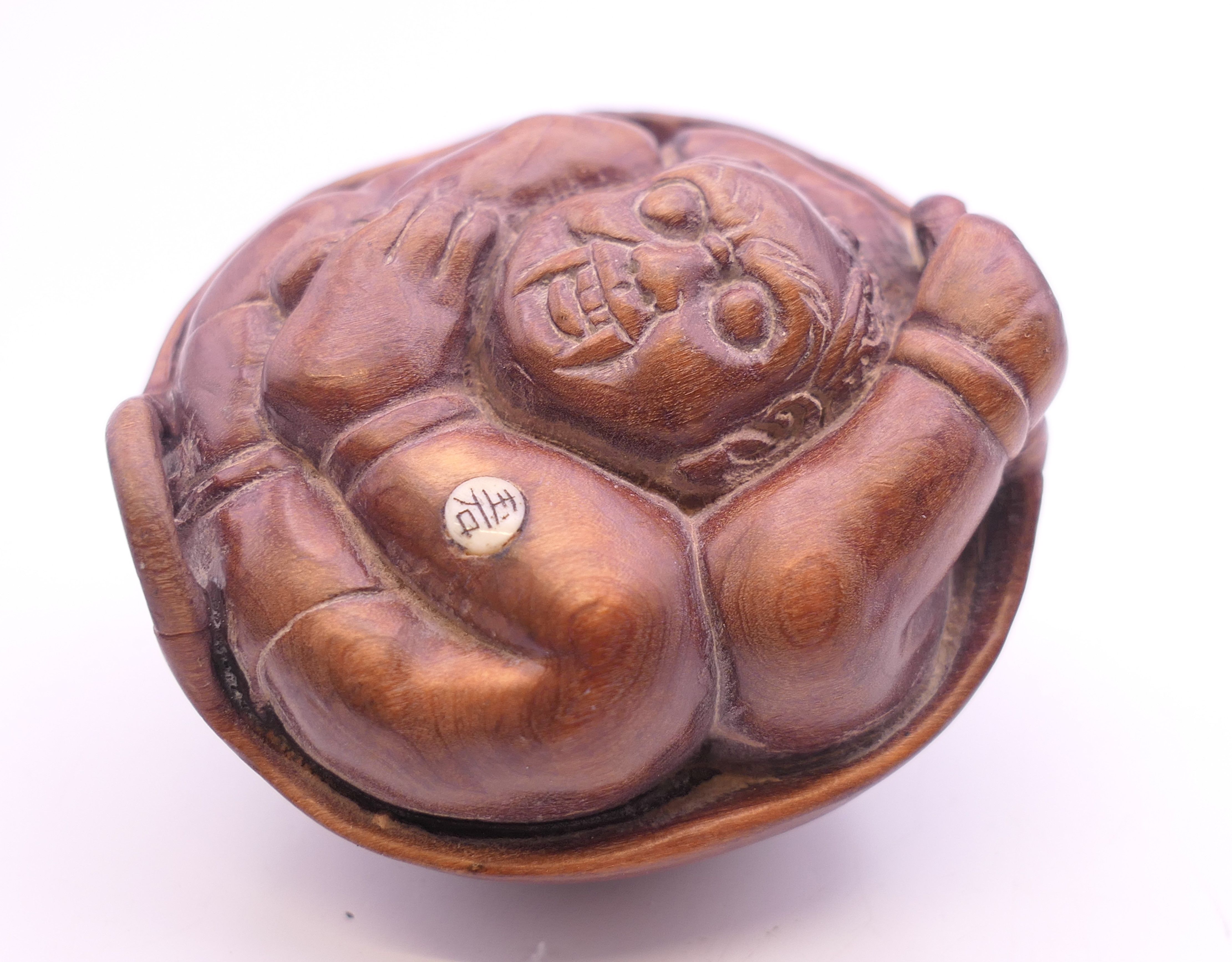 A man in basket carving. 5 cms long.