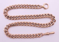A 9 ct gold curb link watch chain. 40 cm long. 25.4 grammes.