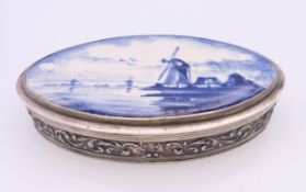 A silver Delft porcelain mounted box. 10.5 cm long.