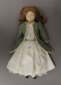 A vintage wax headed doll and a small quantity of doll clothing. The doll 42 cm high.