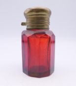 A Victorian ruby glass scent bottle with stopper and brass lid. 6.5 cm high.